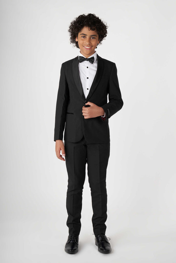 Teen wearing black tuxedo