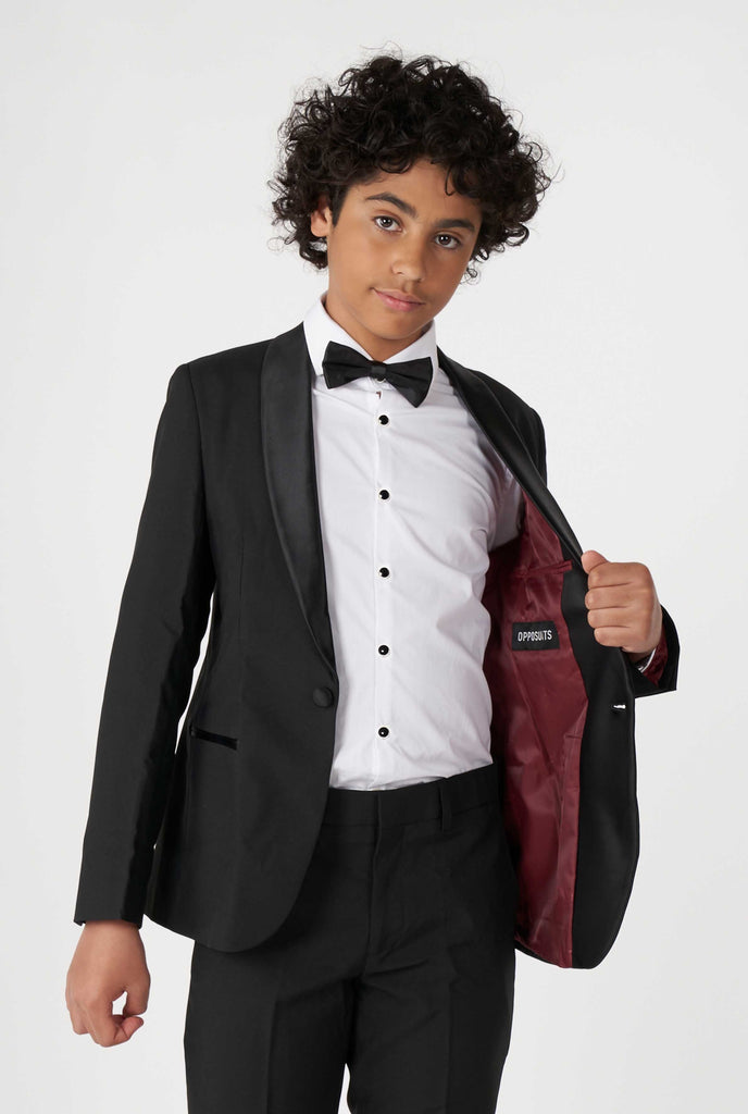 Teen wearing black tuxedo