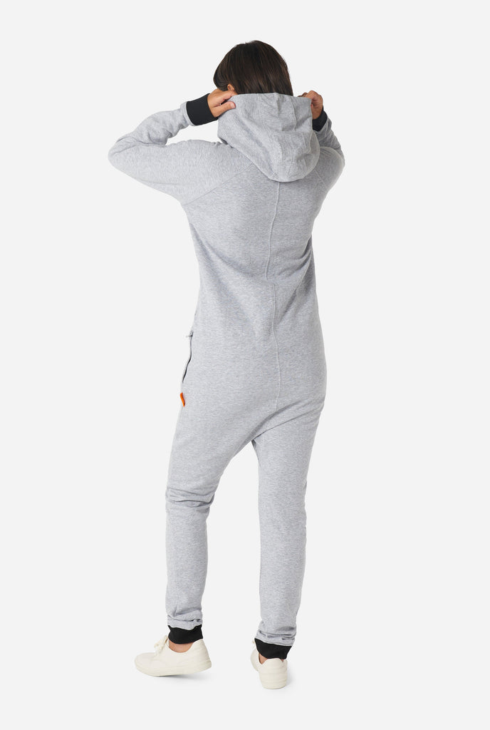 Woman wearing grey onesie, view from the back