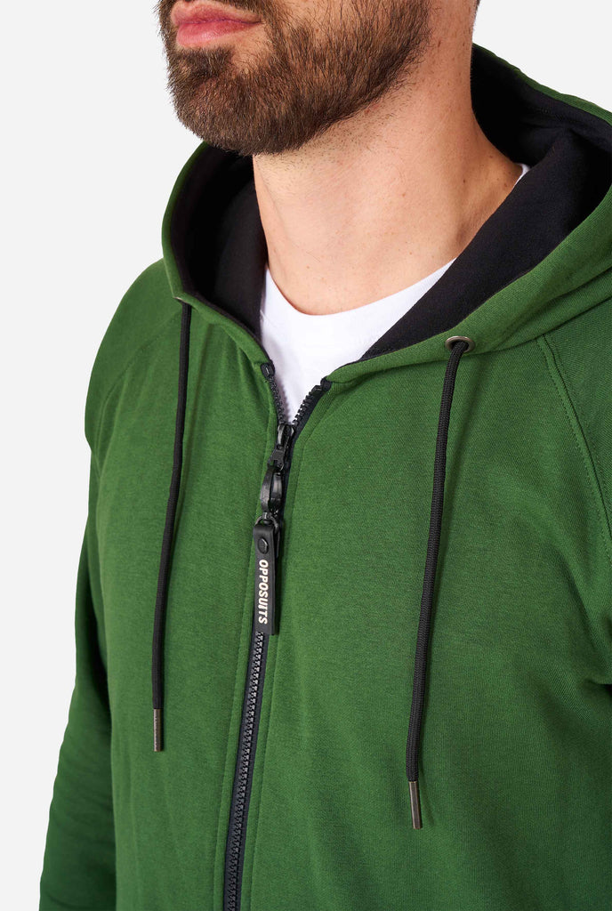 Man wearing green onesie, chest close up