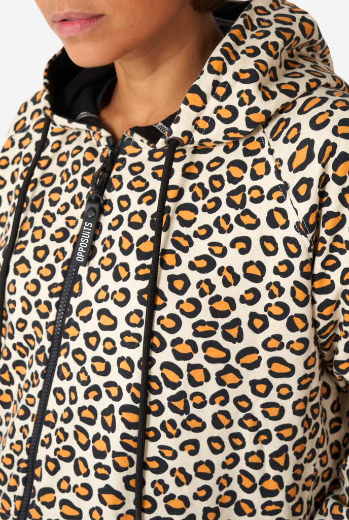 Woman wearing jaguar/ panther print onesie, chest close up