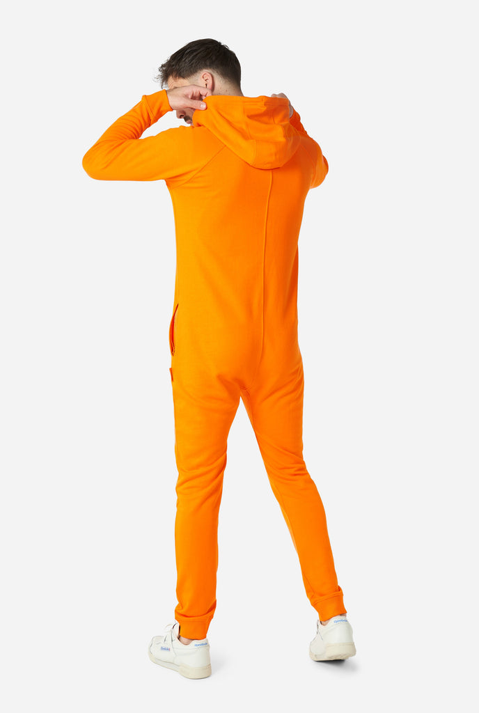 Man wearing orange onesie, view from the back