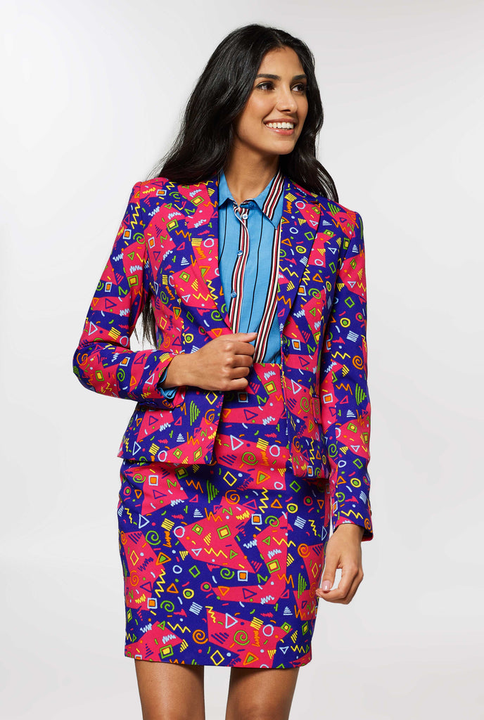 Woman wearing pink and purple suit with retro print